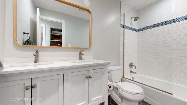 full bath with toilet, vanity, and bathing tub / shower combination