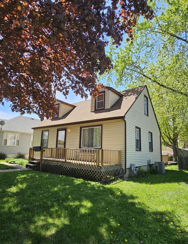 319 S Reed St, Joliet, IL 60436 - view of front of home featuring a wooden deck, a shingled roof, and central air condition unit