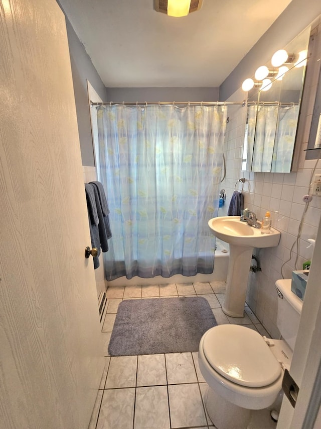 319 S Reed St, Joliet, IL 60436 - full bath with tile walls, toilet, shower / bath combo, tile patterned flooring, and backsplash