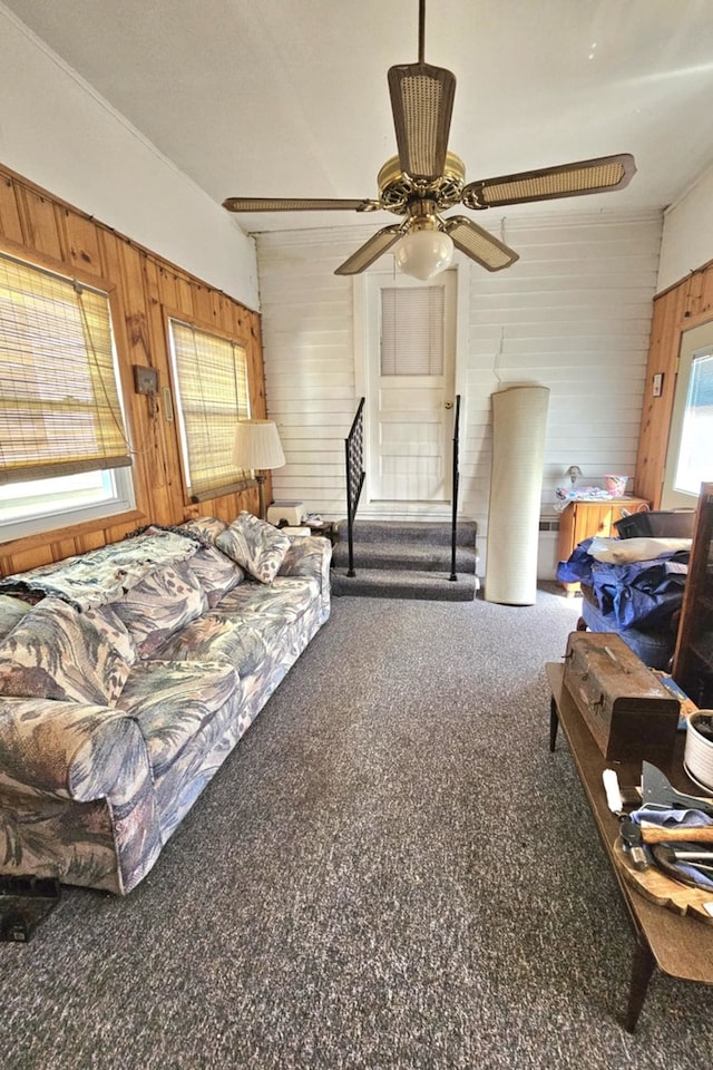 319 S Reed St, Joliet, IL 60436 - living area featuring wood walls, stairs, ceiling fan, and carpet flooring
