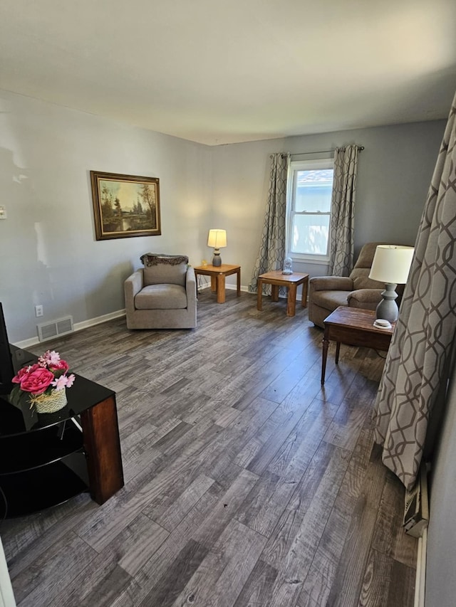 319 S Reed St, Joliet, IL 60436 - living room featuring dark wood-style flooring and baseboards