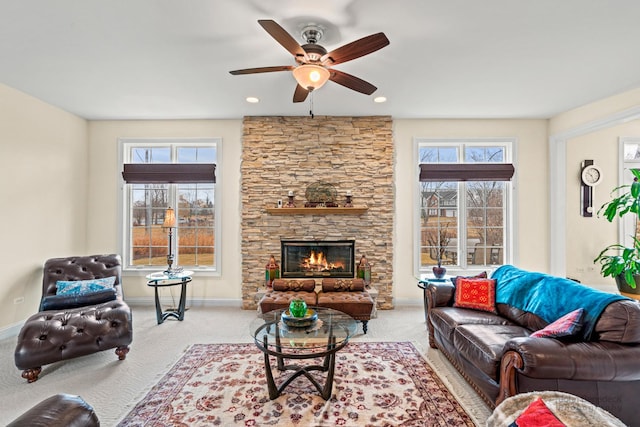 carpeted living area with recessed lighting, a fireplace, a ceiling fan, and baseboards