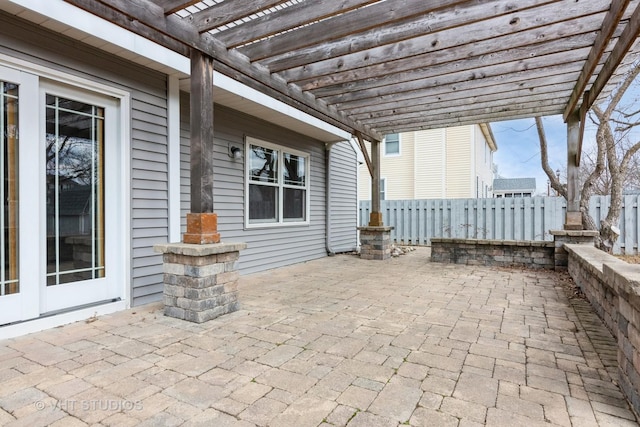 view of patio / terrace featuring fence and a pergola