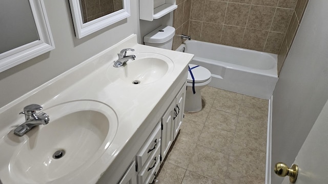 full bathroom with tile patterned floors, vanity, toilet, and tiled shower / bath combo