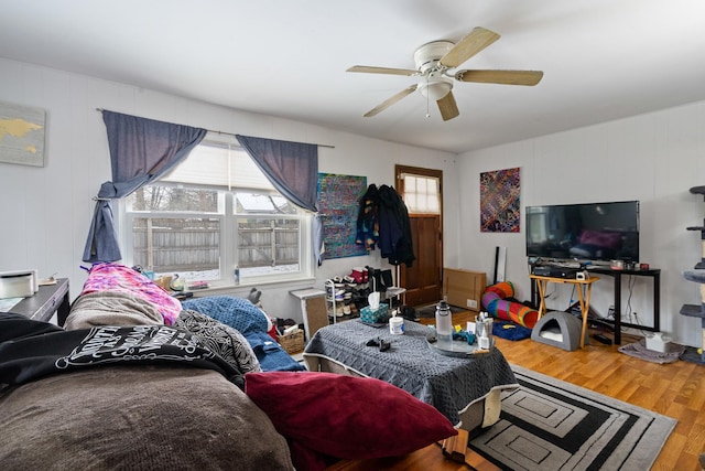 bedroom with hardwood / wood-style flooring and ceiling fan