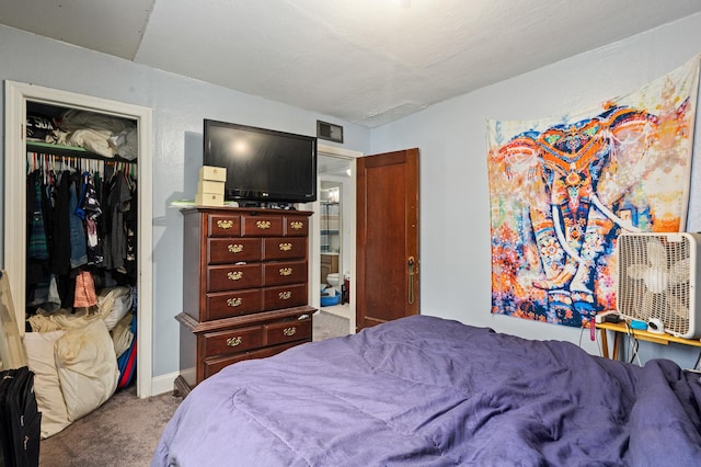 carpeted bedroom with a closet