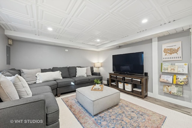 living room with wood-type flooring and electric panel