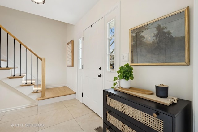 entryway featuring light tile patterned floors