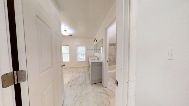 bathroom with vanity and bathtub / shower combination