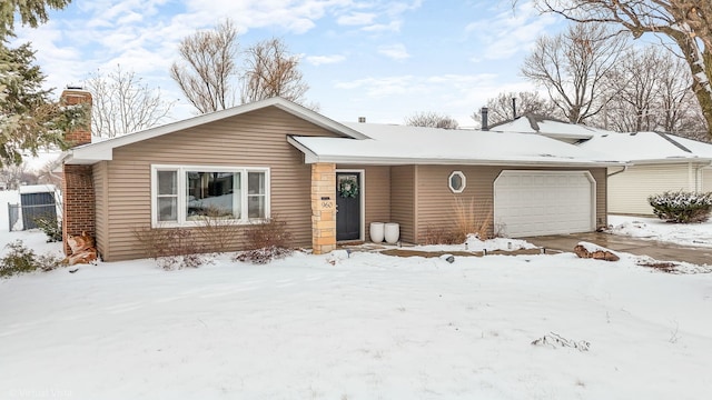 ranch-style house featuring a garage