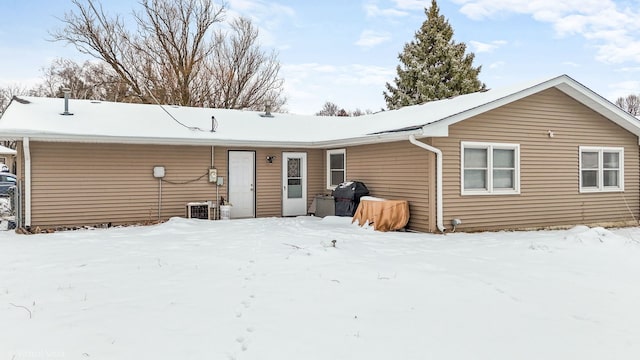 view of snow covered house