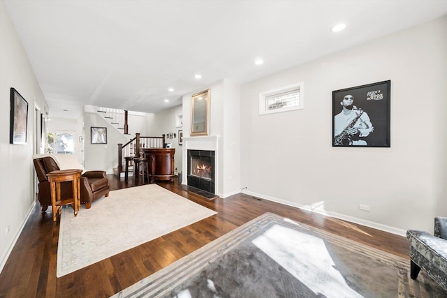 living room featuring dark hardwood / wood-style floors