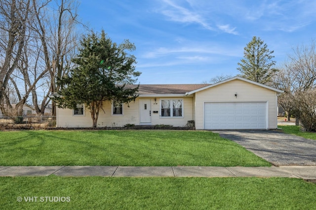 single story home featuring a front yard, fence, a garage, and driveway