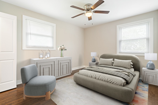 bedroom with wood finished floors, a ceiling fan, and baseboards