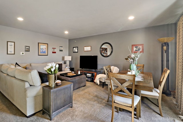 carpeted living area featuring recessed lighting