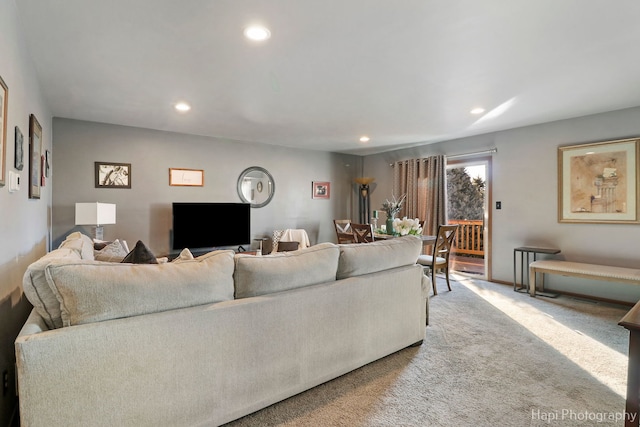 carpeted living area with recessed lighting