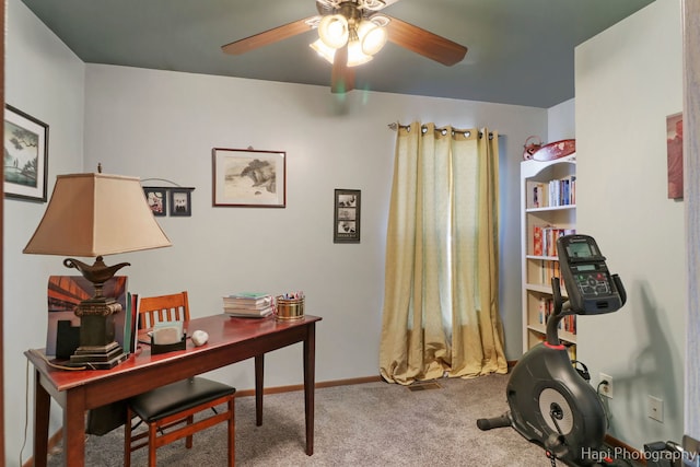 office featuring a ceiling fan, carpet, and baseboards