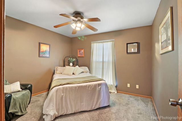 bedroom featuring carpet, a ceiling fan, and baseboards