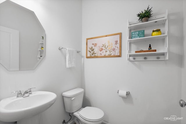 bathroom with a sink and toilet