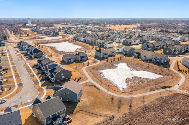 birds eye view of property with a residential view