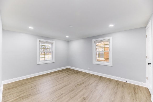 unfurnished room with light hardwood / wood-style floors