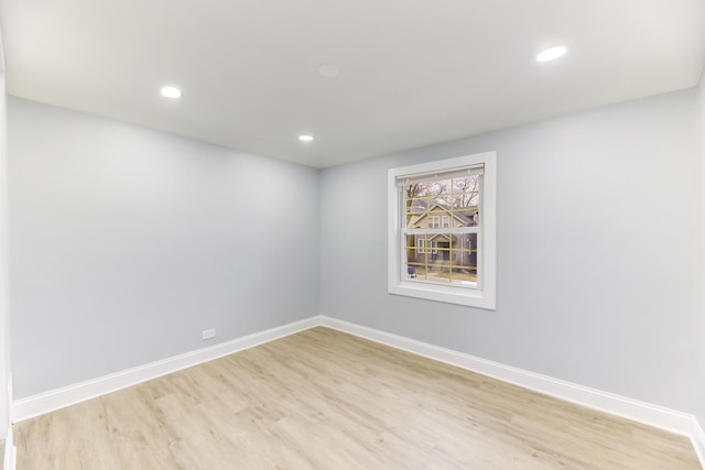 unfurnished room with light hardwood / wood-style floors