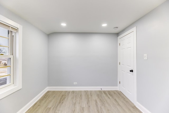 spare room featuring plenty of natural light and light wood-type flooring