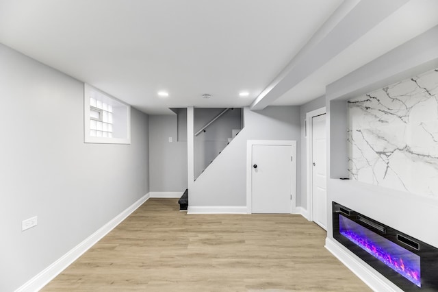 basement featuring light hardwood / wood-style floors