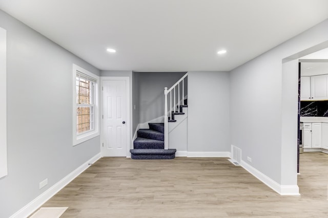 basement featuring light hardwood / wood-style floors