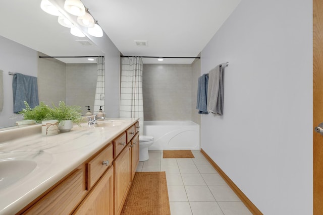 full bathroom with double vanity, toilet, a bathing tub, a sink, and tile patterned floors