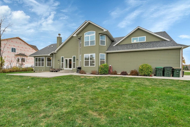 view of front facade featuring a front yard and a patio area