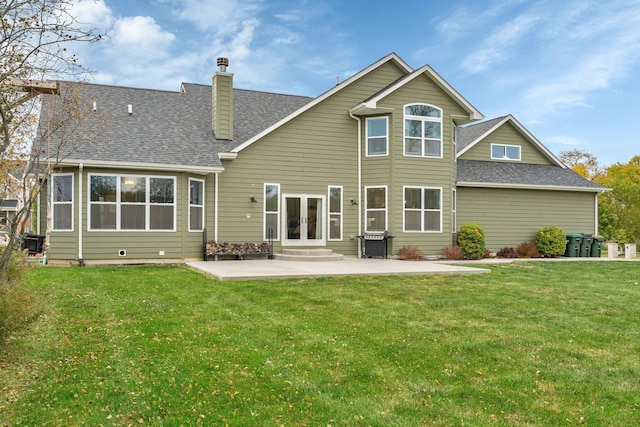 back of house featuring a yard, a patio area, and french doors