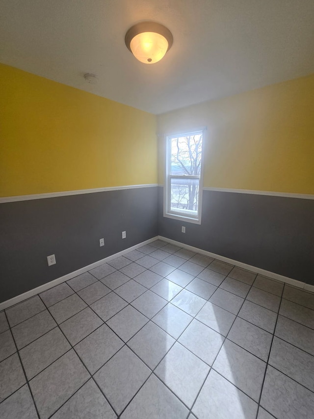 unfurnished room with light tile patterned floors