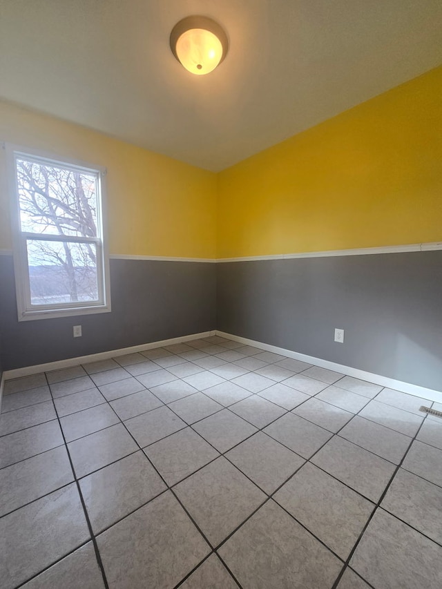 empty room with light tile patterned flooring