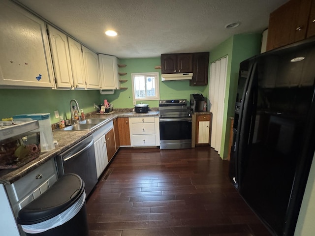 kitchen with white cabinetry, sink, stainless steel appliances, dark wood-type flooring, and a textured ceiling