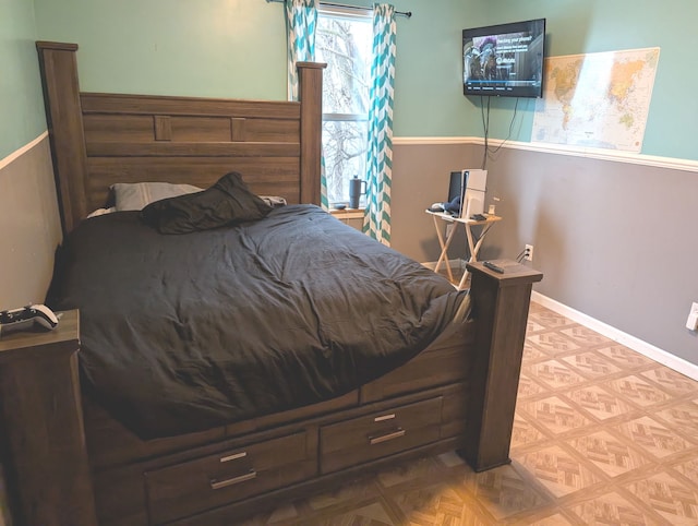 bedroom with light parquet floors