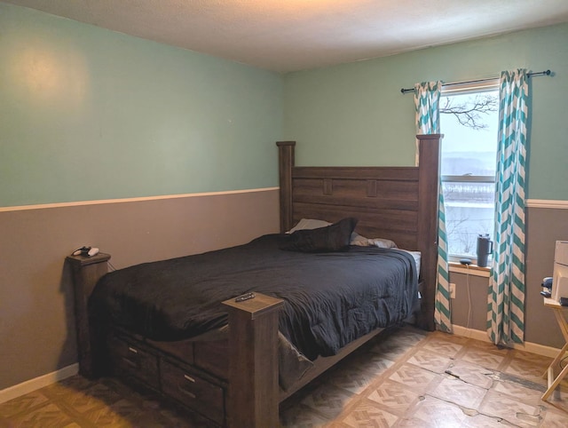 bedroom featuring light parquet flooring