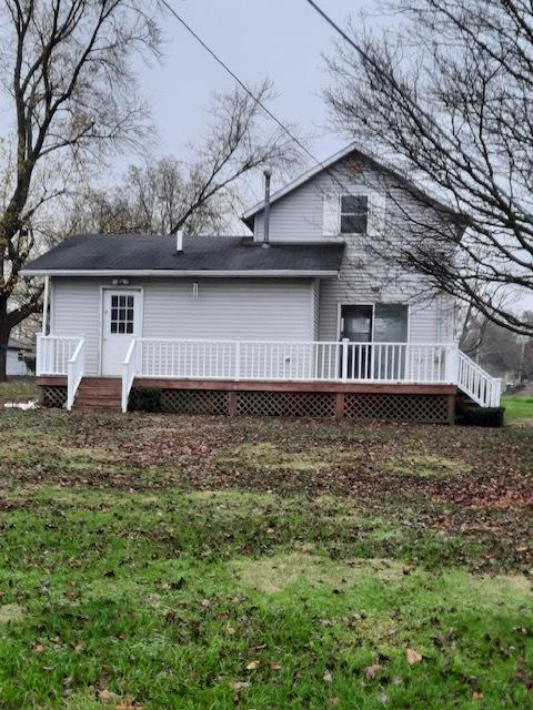 back of property featuring a deck