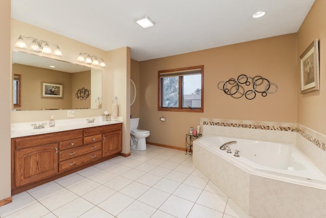 full bath featuring a garden tub, toilet, vanity, baseboards, and tile patterned floors