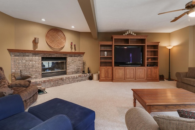 living room featuring beam ceiling, recessed lighting, a brick fireplace, light carpet, and ceiling fan