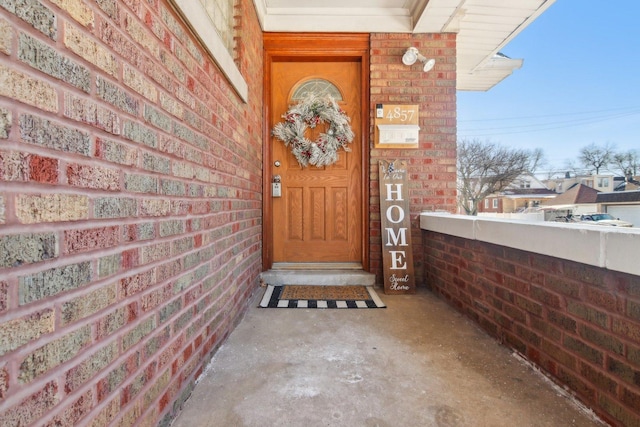 entrance to property with brick siding