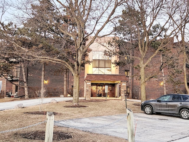 view of front of house featuring brick siding