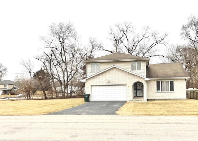 front facade with a garage and a front yard