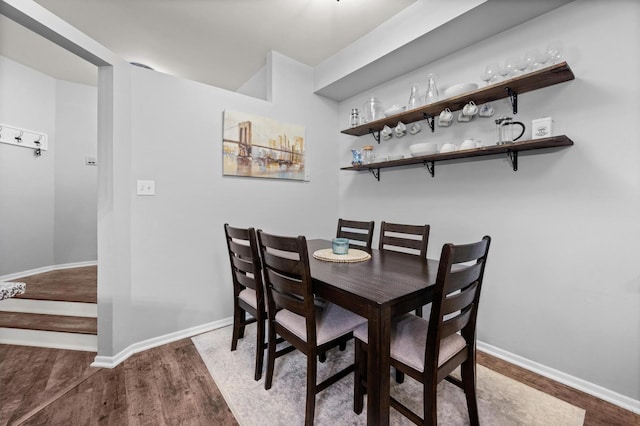 dining space featuring hardwood / wood-style flooring