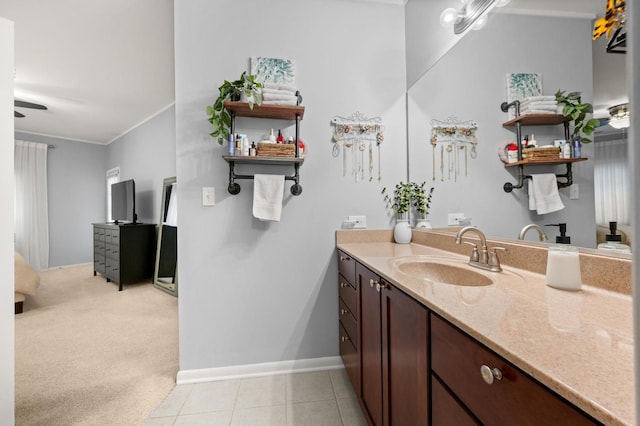 bathroom featuring vanity, ornamental molding, and tile patterned floors