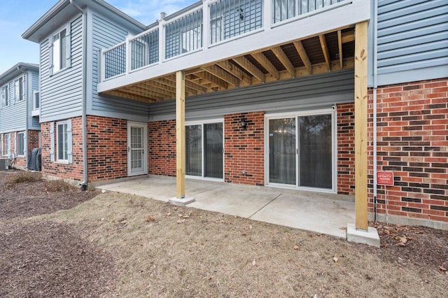 back of property with a patio and central AC unit