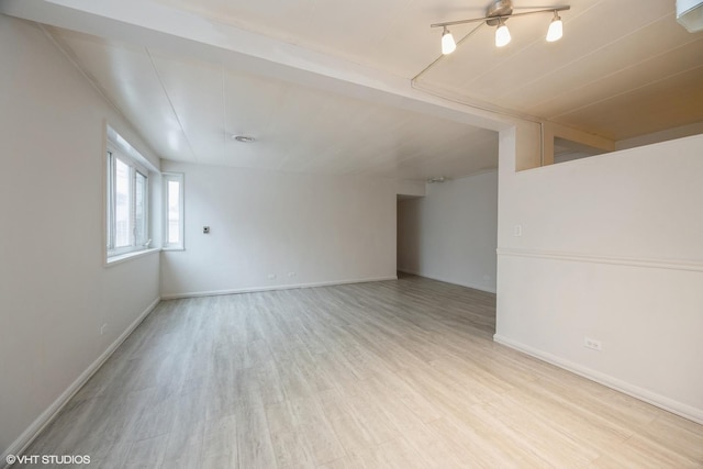 unfurnished room with light wood-type flooring