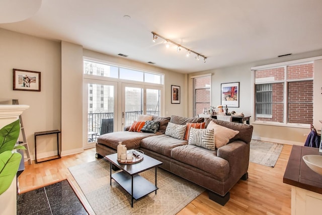 living room with light hardwood / wood-style flooring