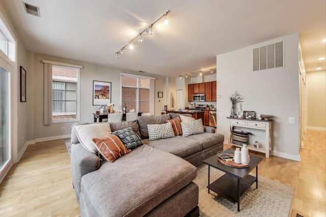 living room with light hardwood / wood-style flooring