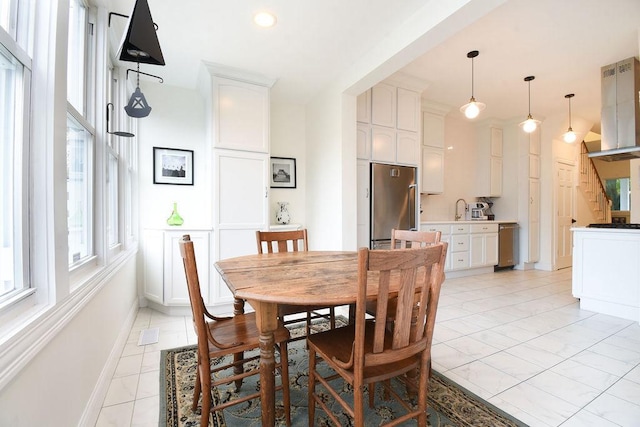 dining area featuring light tile patterned floors